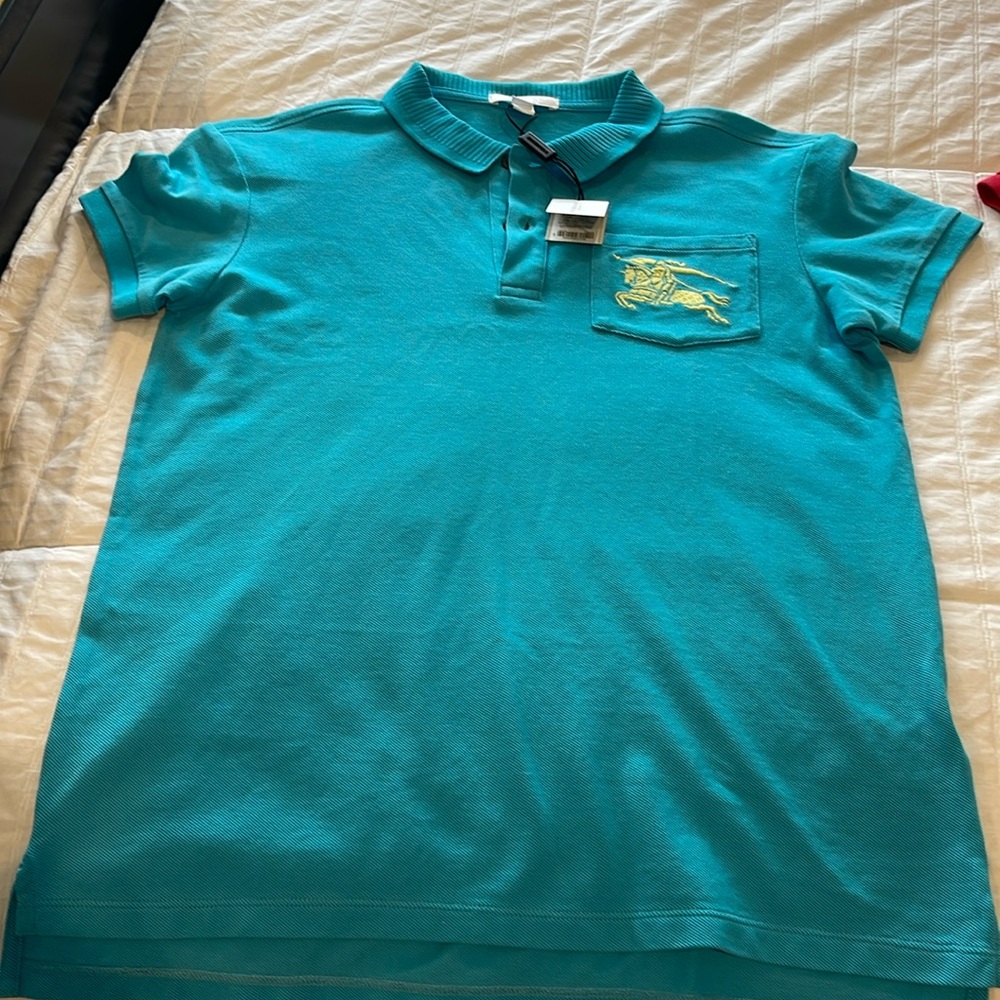 Burberry children’s polo size 14y bright cyan blue new with tags